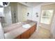 Bathroom vanity with large mirror and a window for natural light at 15349 Oak Apple Ct, Winter Garden, FL 34787