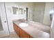 Bathroom with a long vanity and countertop, large mirror, and white shower stall at 15349 Oak Apple Ct, Winter Garden, FL 34787
