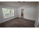Bright bedroom with connecting bathroom and wood-look flooring offers ample natural light at 15349 Oak Apple Ct, Winter Garden, FL 34787