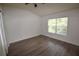 Bright bedroom features wood-look flooring and a large window with natural light at 15349 Oak Apple Ct, Winter Garden, FL 34787