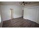 Spacious bedroom features neutral walls, wood-look flooring, and double door closets at 15349 Oak Apple Ct, Winter Garden, FL 34787