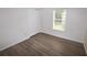 Bedroom featuring new wood flooring and a window at 15349 Oak Apple Ct, Winter Garden, FL 34787
