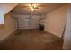 Spacious garage with an automatic door, and overhead storage brackets at 15349 Oak Apple Ct, Winter Garden, FL 34787