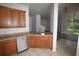 View from kitchen to living and dining area showing stainless steel sink and outdoor access at 15349 Oak Apple Ct, Winter Garden, FL 34787