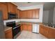 Well-equipped kitchen with stainless steel appliances, light countertops, and ample cabinet space at 15349 Oak Apple Ct, Winter Garden, FL 34787