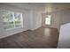 Spacious living room with plenty of natural light through large windows and sleek floors creating modern look at 15349 Oak Apple Ct, Winter Garden, FL 34787