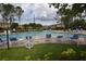 Community pool surrounded by lounge chairs and manicured lawns at 15349 Oak Apple Ct, Winter Garden, FL 34787
