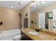 Bright bathroom featuring sleek fixtures, a tub, and a shower with tile surround at 155 S Court Ave # 1608, Orlando, FL 32801