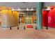 Elegant building entrance featuring decorative colorful columns, glass doors, and a well-maintained walkway at 155 S Court Ave # 1608, Orlando, FL 32801