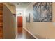 Inviting hallway showcasing wood floors and contemporary artwork at 155 S Court Ave # 1608, Orlando, FL 32801