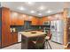 Contemporary kitchen with a central island, granite countertops, and stainless steel appliances at 155 S Court Ave # 1608, Orlando, FL 32801