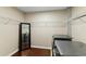 Well-equipped laundry room featuring a full-sized washer and dryer and ample shelving at 155 S Court Ave # 1608, Orlando, FL 32801