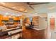 Open-concept living room with hardwood floors, wood paneling, and a modern kitchen at 155 S Court Ave # 1608, Orlando, FL 32801