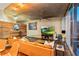 Spacious living room with hardwood floors, a large TV, and modern decor at 155 S Court Ave # 1608, Orlando, FL 32801