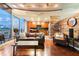 Stylish living room with hardwood floors, modern furniture, and decorative wood paneling at 155 S Court Ave # 1608, Orlando, FL 32801