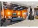 Cozy lobby lounge with comfortable seating, modern lighting, and a large screen TV at 155 S Court Ave # 1608, Orlando, FL 32801