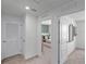 Hallway leading to a bedroom showcasing stylish decor and a well-lit, open feel at 1558 Dalehurst Ln, Kissimmee, FL 34744
