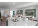 Bright and open layout with a large island, stainless appliances, and adjoining dining space at 1558 Dalehurst Ln, Kissimmee, FL 34744