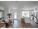 Bright, open-concept space with stainless appliances, modern dining, and living area at 1558 Dalehurst Ln, Kissimmee, FL 34744