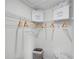 Well-organized walk-in closet with wire shelving and hanging clothes and handbags at 1558 Dalehurst Ln, Kissimmee, FL 34744