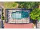 Aerial view of a private screened-in pool surrounded by well-manicured landscaping, offering a serene backyard oasis at 1744 Pine Ridge Dr, Davenport, FL 33896