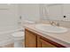 Bright bathroom featuring a tub, shower and toilet, and a single sink vanity at 1744 Pine Ridge Dr, Davenport, FL 33896