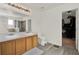 Bathroom featuring a double vanity, tile flooring, and walk in closet at 1744 Pine Ridge Dr, Davenport, FL 33896