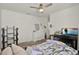 Cozy bedroom with a ceiling fan, white dresser, and natural light at 1744 Pine Ridge Dr, Davenport, FL 33896