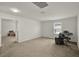 Bonus room with neutral carpet, white walls, and plentiful natural light at 1744 Pine Ridge Dr, Davenport, FL 33896