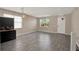 Spacious bonus room with hardwood floors, neutral walls, large windows and plenty of space for entertaining at 1744 Pine Ridge Dr, Davenport, FL 33896