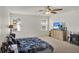 Spacious main bedroom with ceiling fan, neutral carpet, and plenty of natural light at 1744 Pine Ridge Dr, Davenport, FL 33896