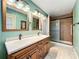 Bathroom featuring a double vanity with granite counters and tile floors, plus a glass-enclosed shower at 1846 Branchwater Trl, Orlando, FL 32825
