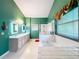 Bathroom featuring a glass shower, a soaking tub, and a dual sink vanity with marble countertops at 1846 Branchwater Trl, Orlando, FL 32825