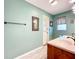 Bathroom view showcasing the neutral color scheme, granite counters, and a mounted towel rack at 1846 Branchwater Trl, Orlando, FL 32825