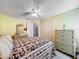 Bedroom with a ceiling fan, view of closet, and an antique dresser at 1846 Branchwater Trl, Orlando, FL 32825