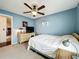 Bedroom with a ceiling fan, window, and minimal decor at 1846 Branchwater Trl, Orlando, FL 32825