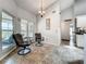 Light-filled breakfast nook with tile floors and outdoor views through a large picture window at 1846 Branchwater Trl, Orlando, FL 32825
