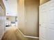 Hallway view showcasing carpeted floors, neutral walls, and access to the bedroom at 1846 Branchwater Trl, Orlando, FL 32825