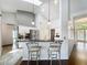 Bright kitchen with stainless steel appliances, a breakfast bar, and pendant lighting under a vaulted ceiling at 1846 Branchwater Trl, Orlando, FL 32825