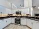 Well-appointed kitchen features stainless steel appliances, tile backsplash, and ample counter space at 1846 Branchwater Trl, Orlando, FL 32825
