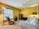 A cozy sitting room featuring a large sofa and a comfortable rocking chair near a bright window at 1846 Branchwater Trl, Orlando, FL 32825