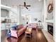 Spacious living room with open layout, fireplace, hardwood floors, and connection to kitchen area at 1846 Branchwater Trl, Orlando, FL 32825