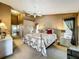Large main bedroom with a comfortable bed, decorative details, and an attached bathroom at 1846 Branchwater Trl, Orlando, FL 32825