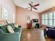 Home office space with hardwood floors, plantation shutters, neutral paint, and comfortable seating at 1846 Branchwater Trl, Orlando, FL 32825