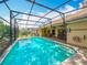 Backyard view of a private pool with a screened-in lanai and comfortable outdoor seating at 1846 Branchwater Trl, Orlando, FL 32825