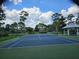 A beautifully maintained tennis court is featured in a lush and welcoming community setting at 1846 Branchwater Trl, Orlando, FL 32825