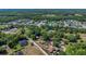 Aerial view of a home in a residential neighborhood near a pond at 2045 South St, Oviedo, FL 32765