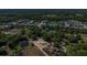 Aerial view of a property in a quiet neighborhood surrounded by mature trees at 2045 South St, Oviedo, FL 32765
