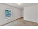 A bright bedroom with carpet and one window at 2045 South St, Oviedo, FL 32765