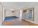 A modest living room with a window AC unit and wood-look flooring at 2045 South St, Oviedo, FL 32765